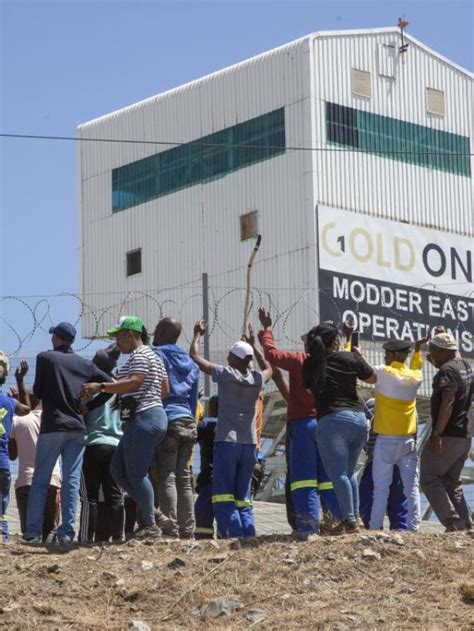 Miners from a rival union are holding hundreds of colleagues underground in South Africa, police say